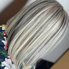 A close-up of a woman straight short blonde hairstyle