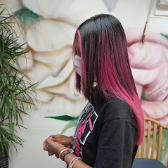 Woman showing her straight pink color hair
