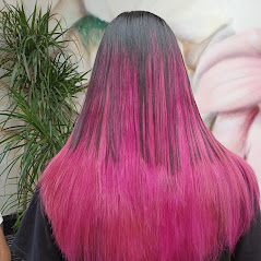 Woman showing her straight pink color hair